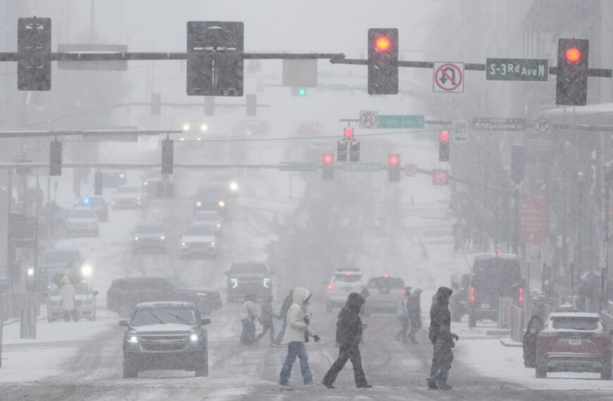 US weather: 140,000 without power as winter storm stretches from Colorado to New England