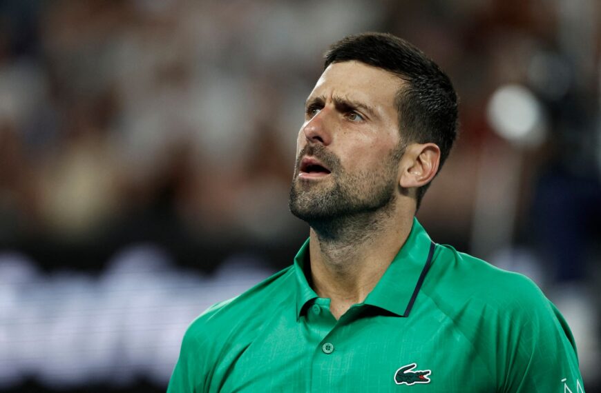 Djokovic apologises after ball nearly hits ball girl during history-making win at Australian Open