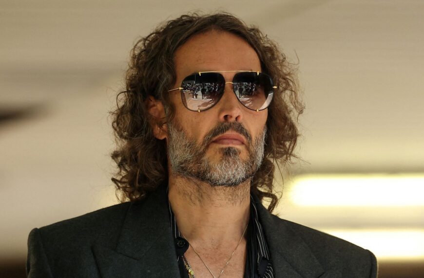 Russell Brand appears in court via video link from US to face further rape and sexual assault charges