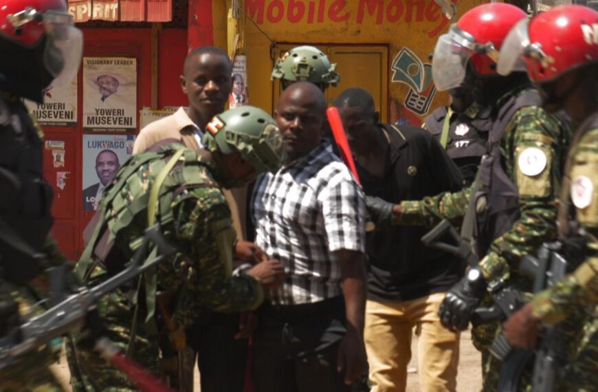 ‘People power’ opposition supporters shout as voting count in Uganda election turns violent