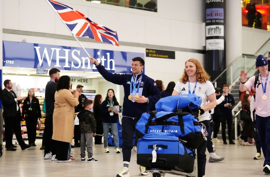 Jubilant Team GB return home after record-breaking Winter Olympics
